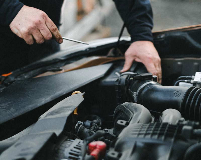 checking the car's engine and AC system